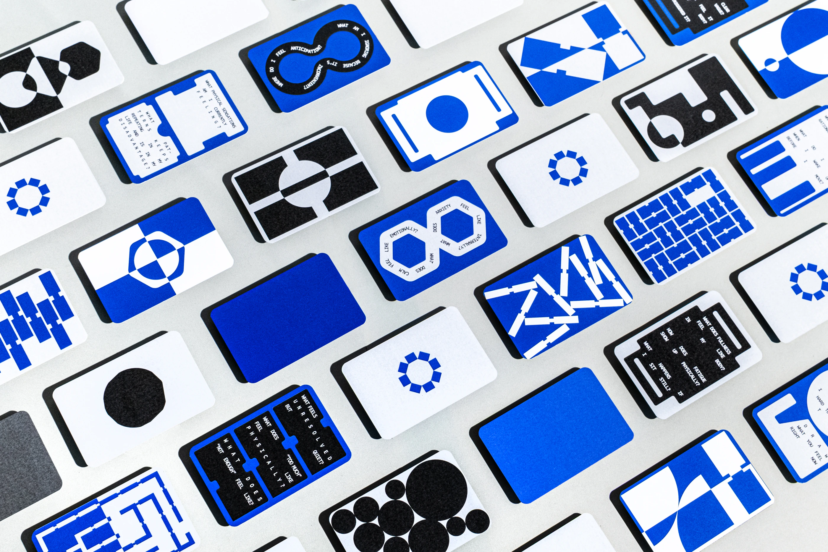 RE:MIND blue, black and white visual-journalling cards arranged in a grid