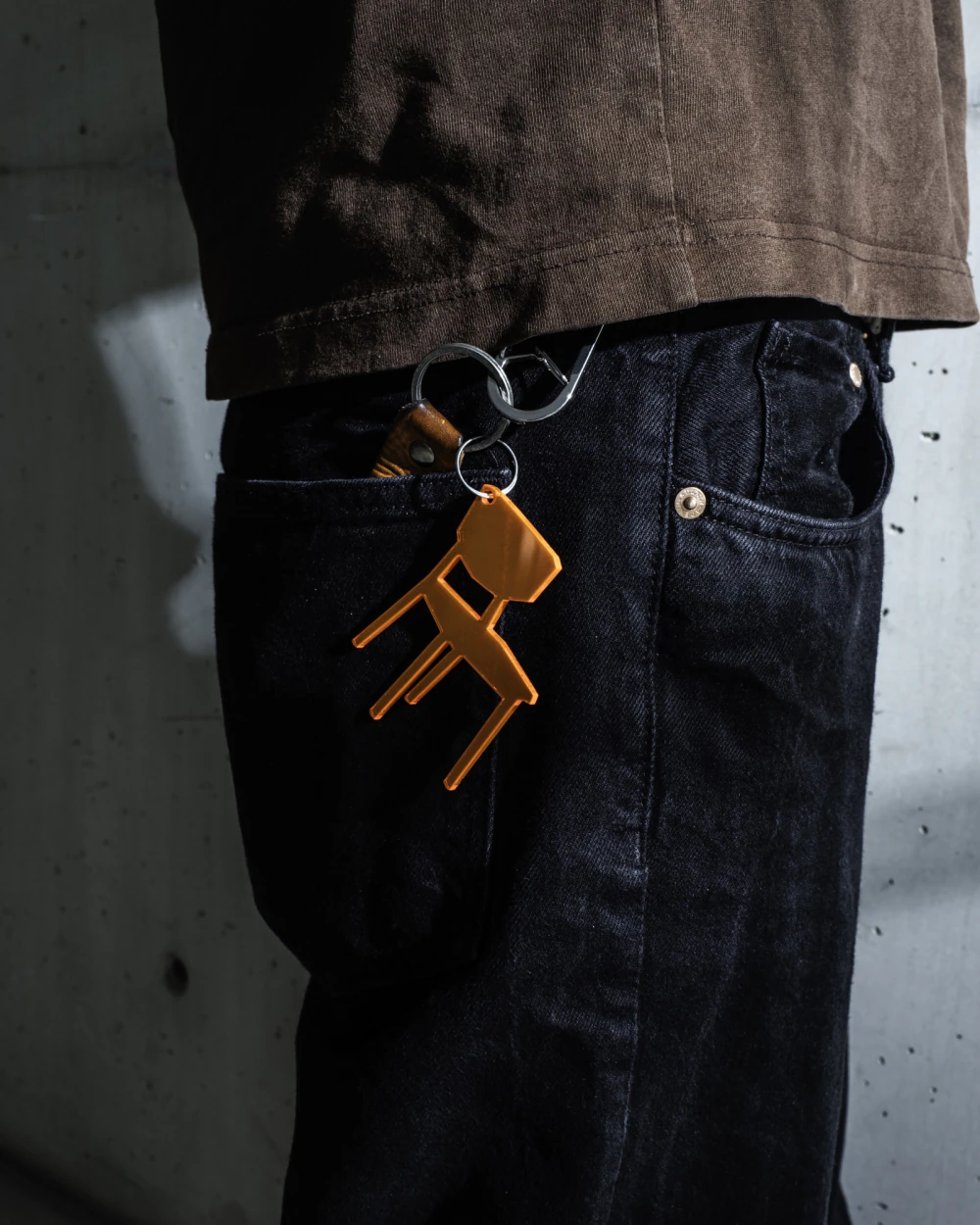 Orange WALK WITH ME chair-shaped keychain