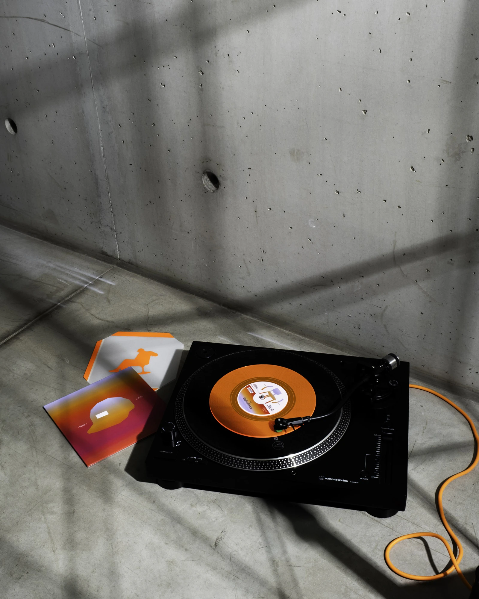 Orange WALK WITH ME record playing on a turntable