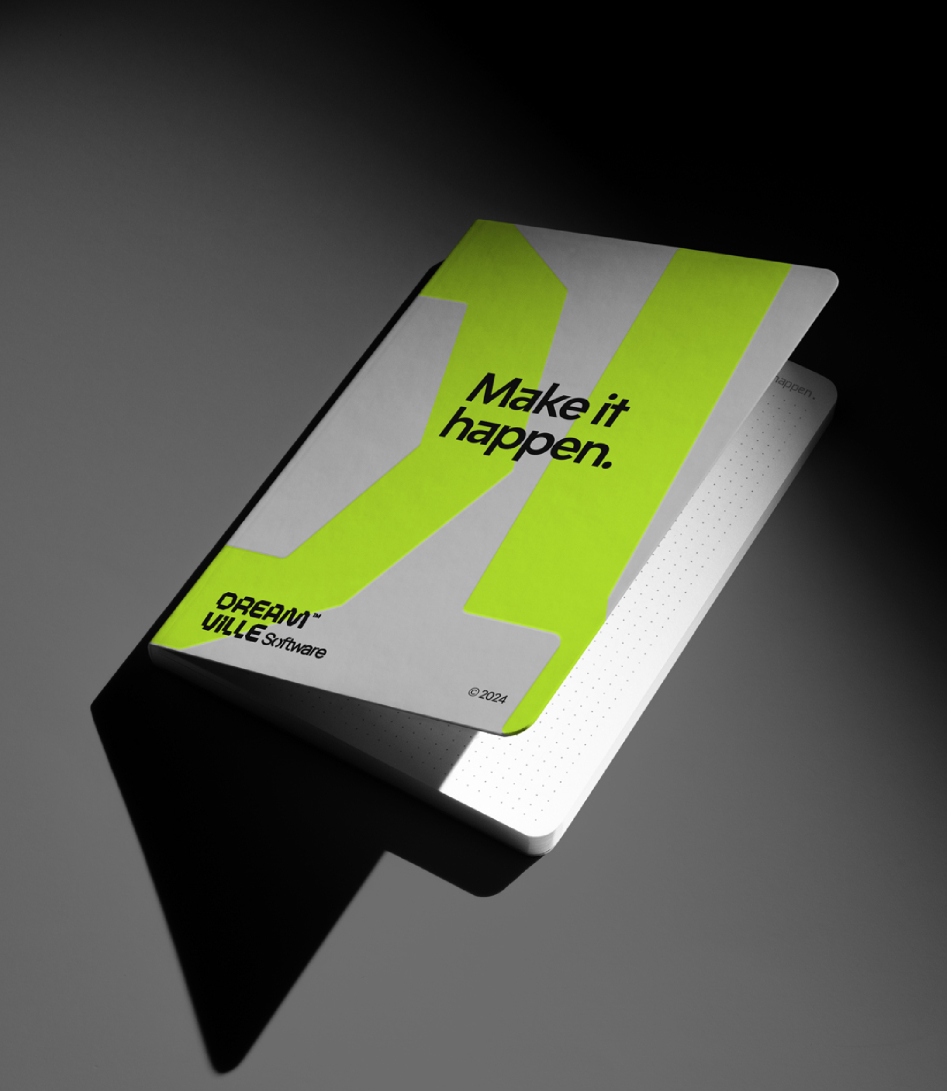 Dream Ville Software branded notebook with a fluorescent green accent