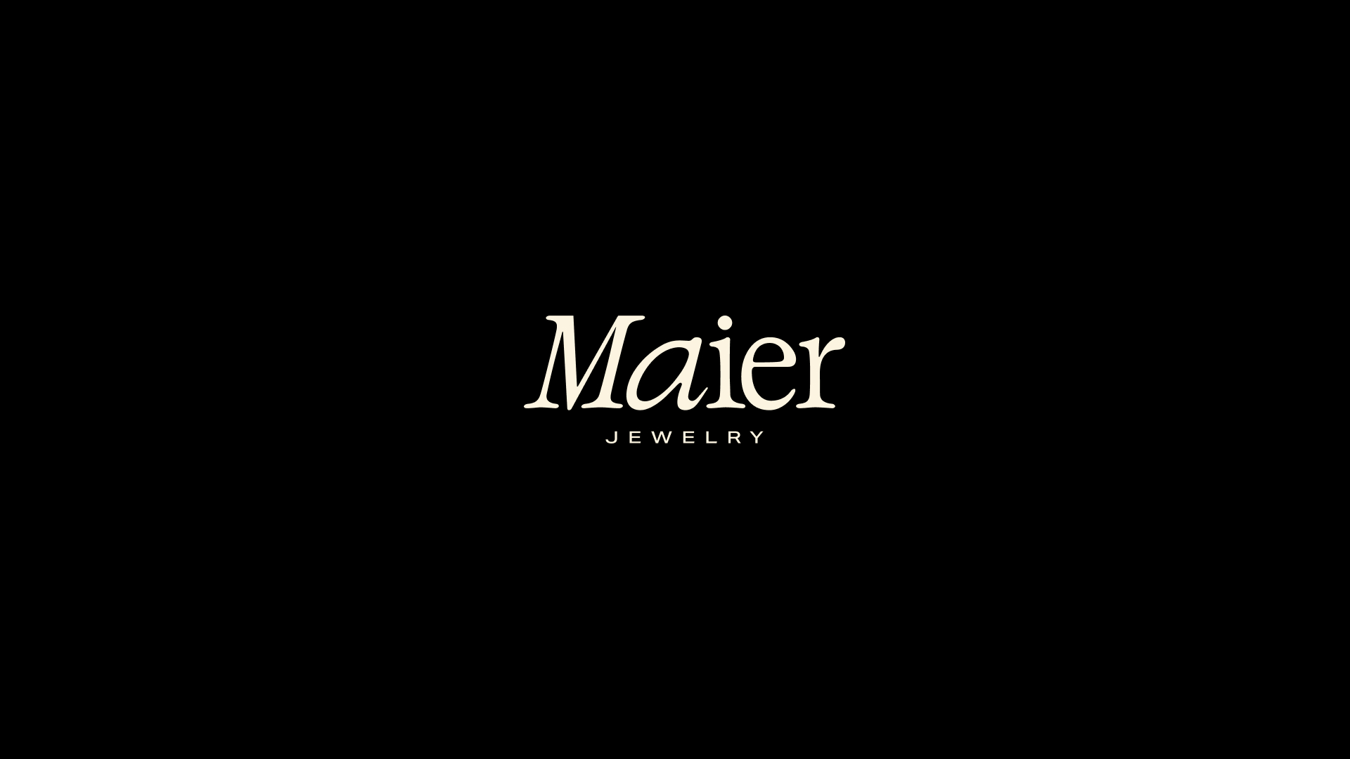 Maier Jewelry wordmark in ivory on a black background
